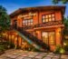 Champa Baag Resort Jagdalpur building with lush green garden, rustic architecture, warm evening lights, and peaceful nature ambience.