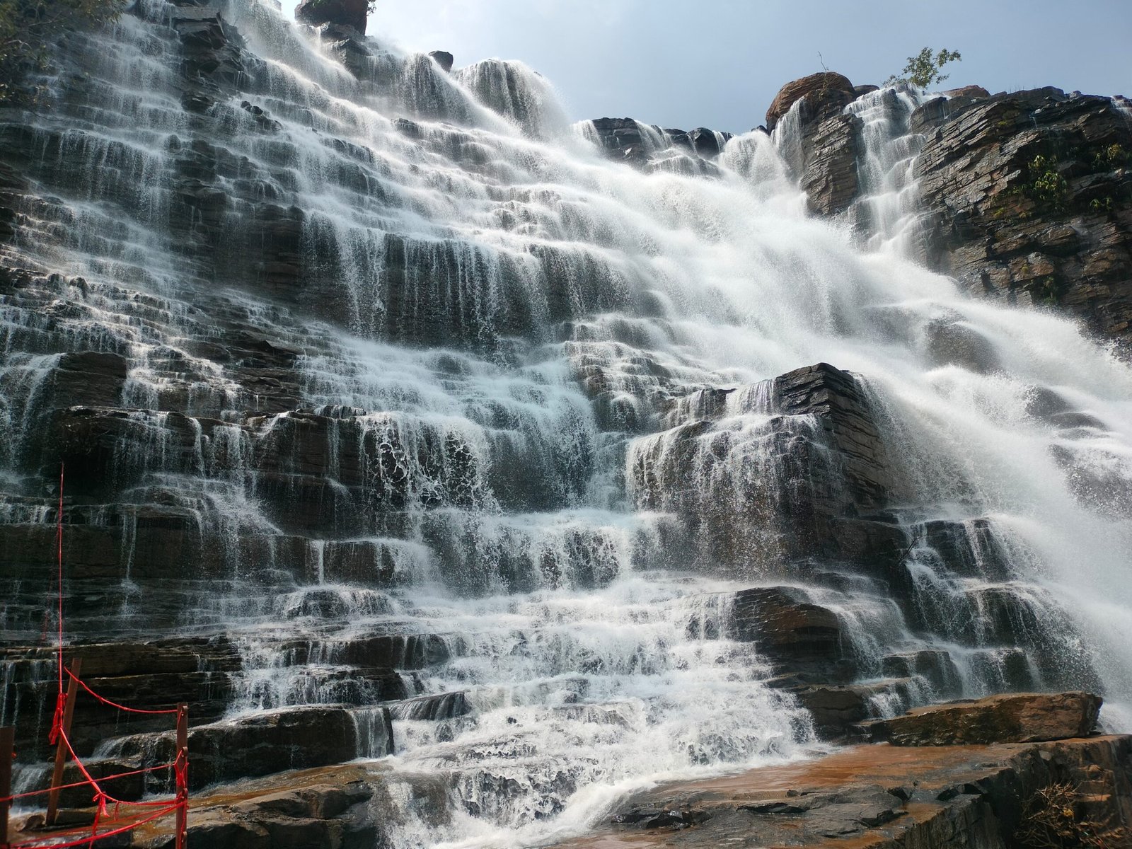 Tirathgarh Waterfall in Kanger Valley National Park, Bastar, Chhattisgarh with cascading multi-tiered waterfalls surrounded by lush green forest.
